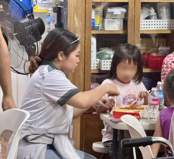 A Bednbody volunteer spending time with a child